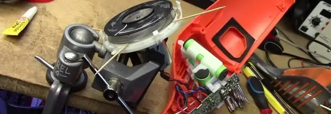 Vacuum cleaner repair parts and tools on a workbench in Clearwater, FL