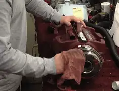 Vacuum repair technician cleaning and servicing a vacuum motor in Clearwater, FL